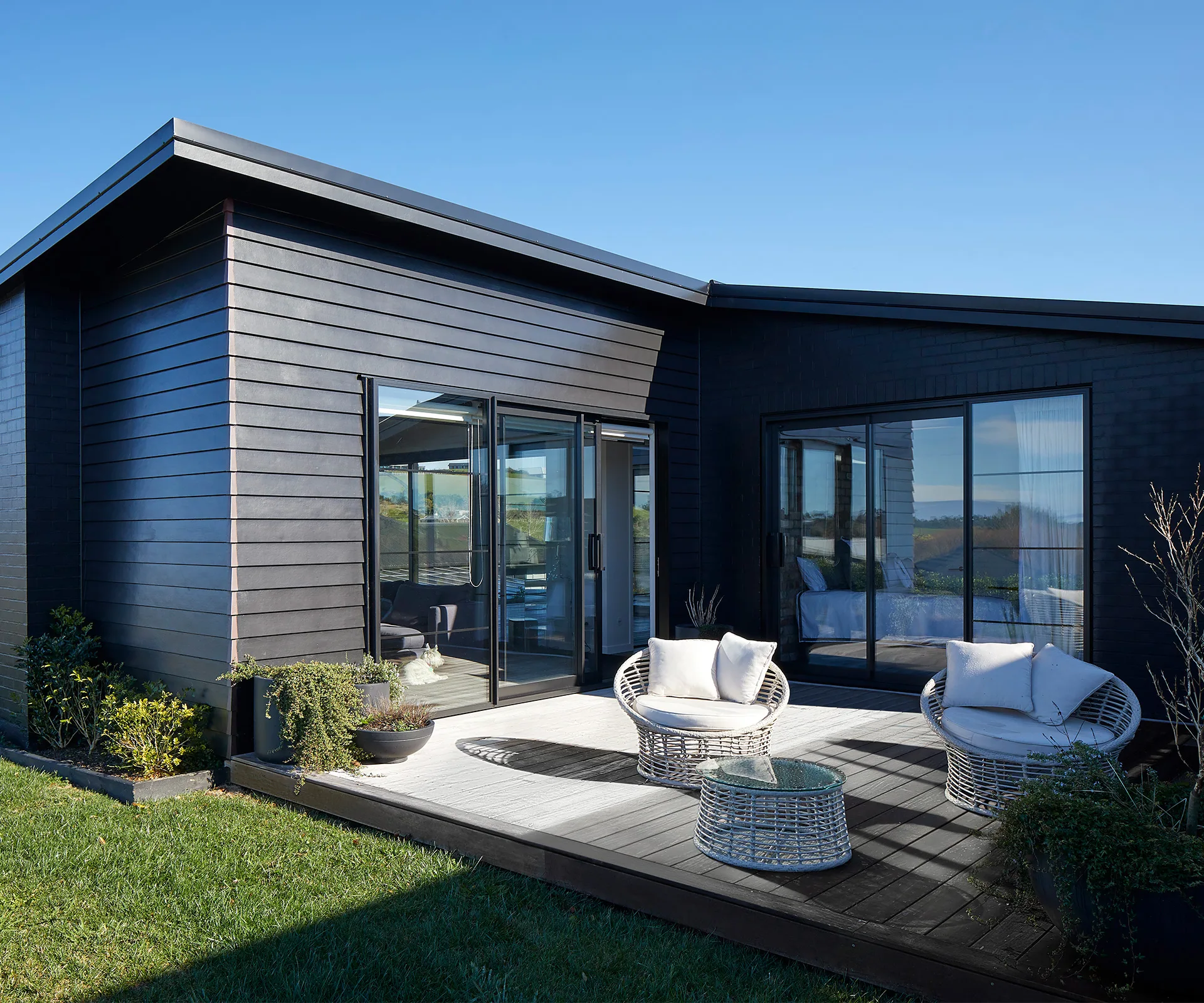 This Striking Black clad Home Brings Tuscany And New York To Matakana this-striking-black-clad-home-brings-tuscany-and-new-york-to-matakana