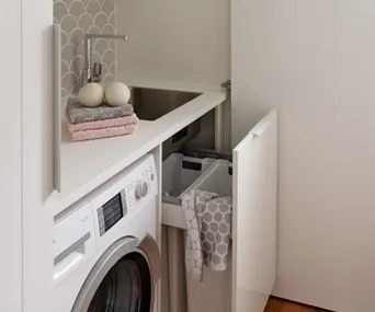 This cupboard laundry achieves style and practicality in a small space