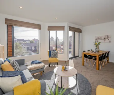 Live the good life in this split level apartment just moments from the beach