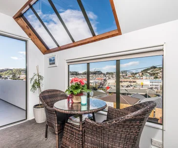 Enjoy space and sun in this elevated Newtown home for sale