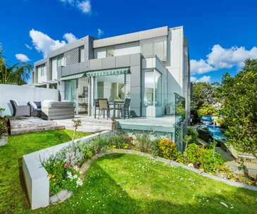 Enjoy luxury living close to the sea in this Mairangi Bay townhouse