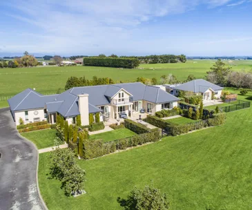 This idyllic lifestyle block comes with two impressive homes