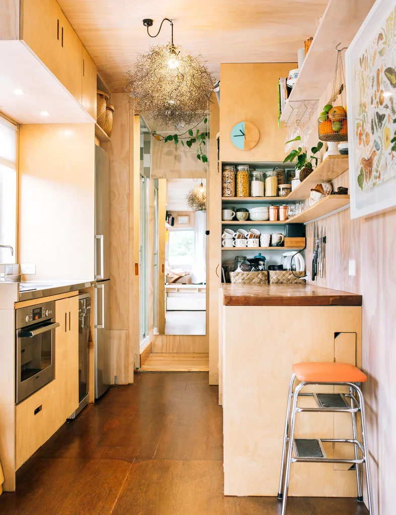 The wooden kitchen in the shipping container home