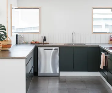 This elegant kitchen makes a strong case for dark green cabinets