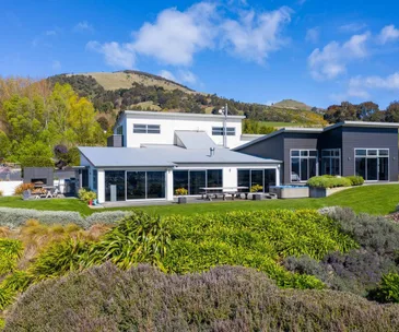 This Mosgiel home comes with stunning views and its own olive grove