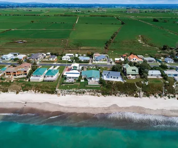 Enjoy both seaside living and rural tranquility at this Pukehina home