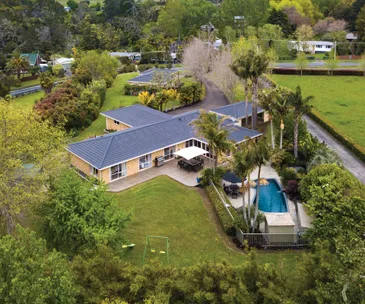 Come home to paradise at this one-acre sanctuary in Whenuapai