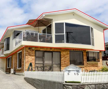 Enjoy functional family living with sea views at this New Plymouth home