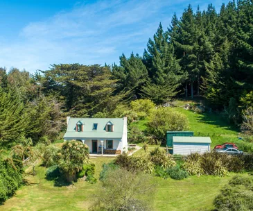 This charming Taieri Mouth cottage is filled with character and history