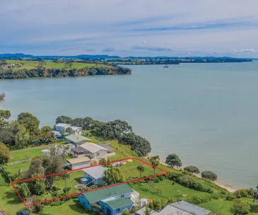 This waterfront Awhitu bach for sale is all set up for a classic Kiwi summer