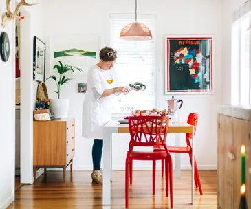 Inside a mid-century home where intriguing objects and pops of colour reign