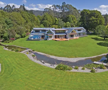 This park-like property in Golden Bay is waterfront living at its best