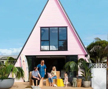 This pink A-frame home is a nostalgic holiday retreat for a family of 4