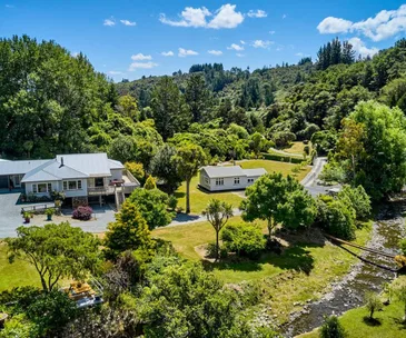 This impressive property comes with two houses on two acres