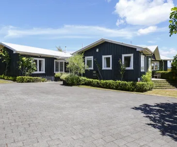 Country cottage charm awaits at this Waipahihi home for sale