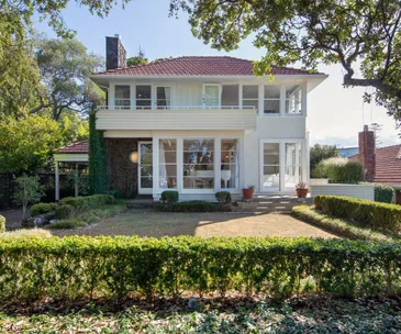 This 4-bedroom home comes with character and glimpses of the harbour