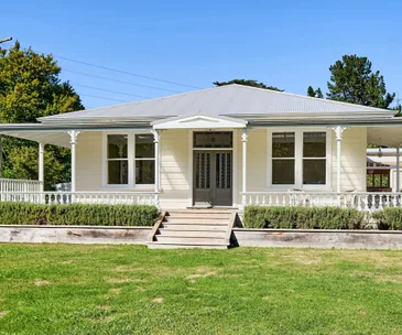 This historic cottage for sale in Judgeford is full of old-world charm