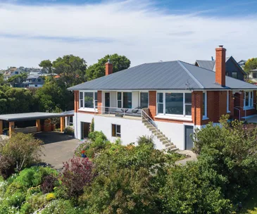 This solid 5-bedroom home comes with sweeping harbour views