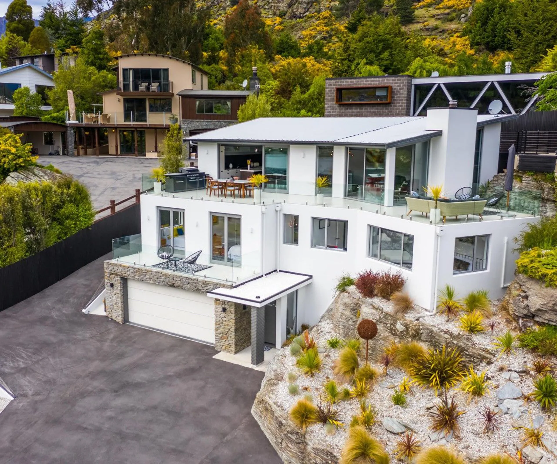 Enjoy lake views from this luxurious fully-furnished Queenstown home