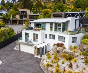 Enjoy lake views from this luxurious fully-furnished Queenstown home