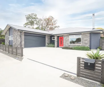 This low-maintenance home for sale will make you forget the lawnmower