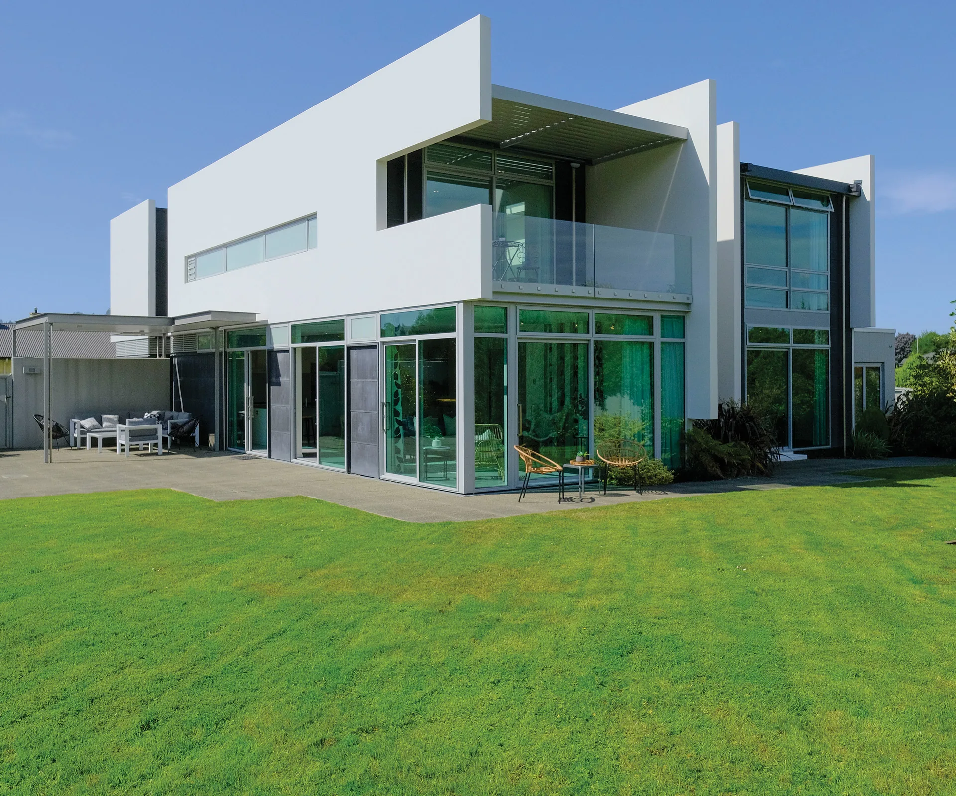 This contemporary 6-bedroom home features modern architectural style