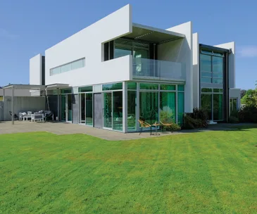 This contemporary 6-bedroom home features modern architectural style