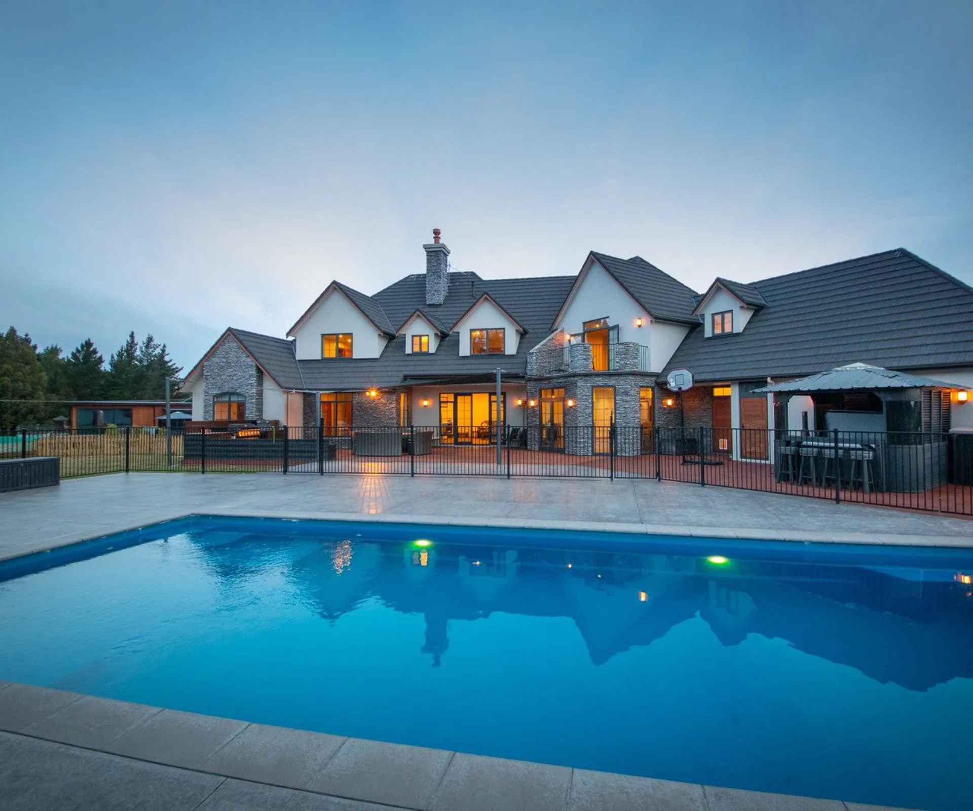 This grand 7-bedroom home for sale comes with a heated pool