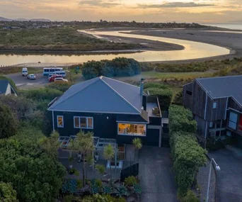 This stunning seaside home might just have the best location in Kapiti