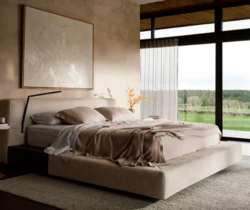 Modern bedroom with a large bed, beige bedding, abstract wall art, and floor-to-ceiling windows overlooking greenery.