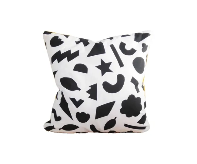 modern black and white home decor cushion with shapes all over it