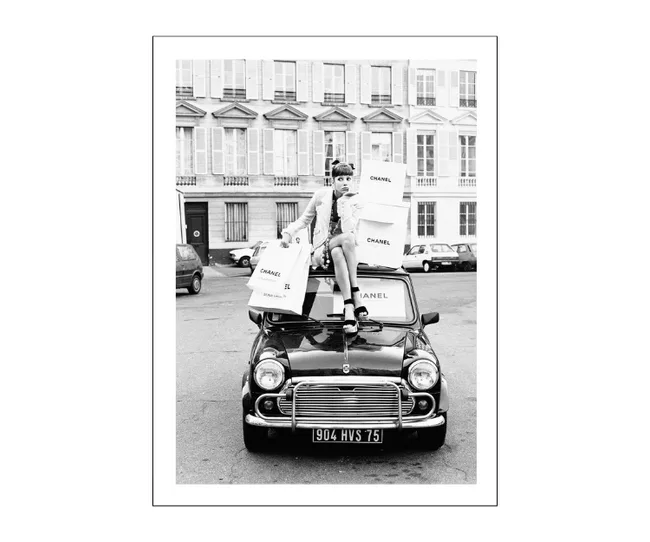 modern black and white home decor photo print of woman sitting on top of a car