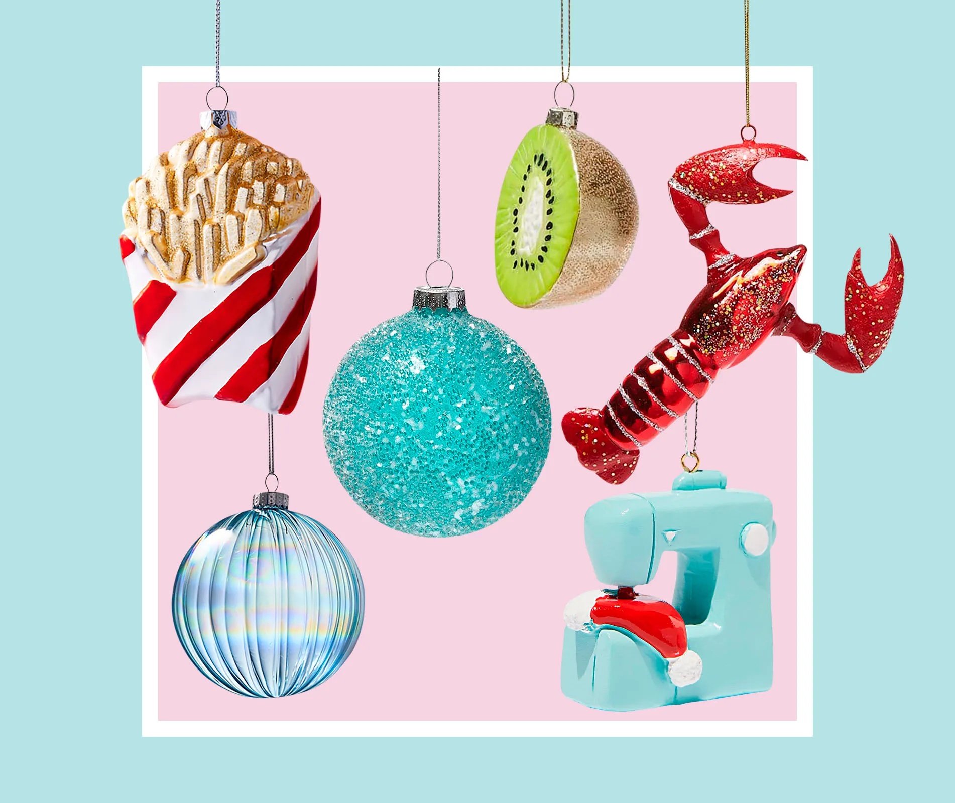 Colorful Christmas ornaments: fries, kiwi, glitter ball, lobster, glass orb, sewing machine, against pastel background.
