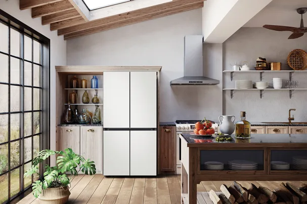 Modern kitchen with a Samsung refrigerator, wooden cabinets, skylight, and black-framed windows.