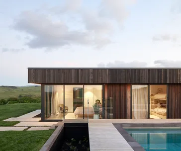 This cedar-clad Raglan home has stunning views to the sea