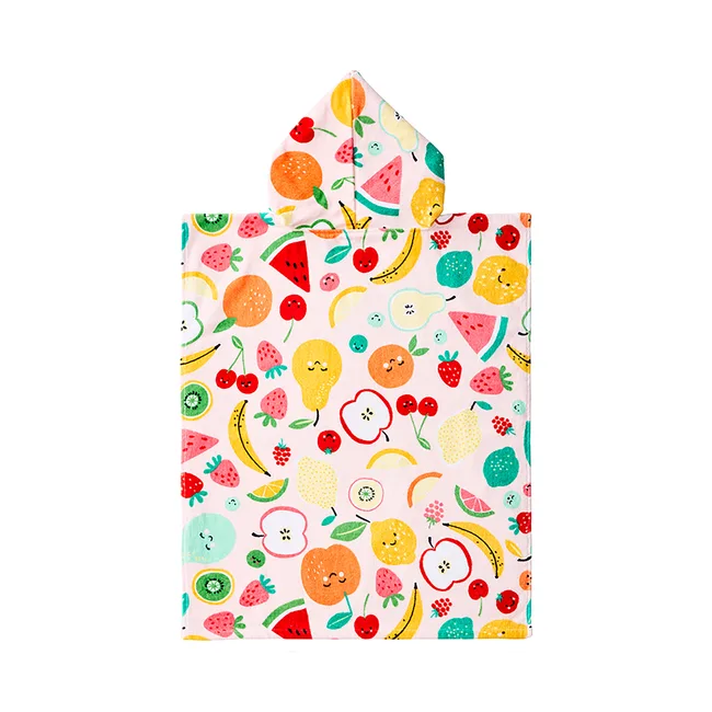 Colorful poncho towel with smiling fruit patterns like oranges, apples, cherries, bananas, and melons on a white background.