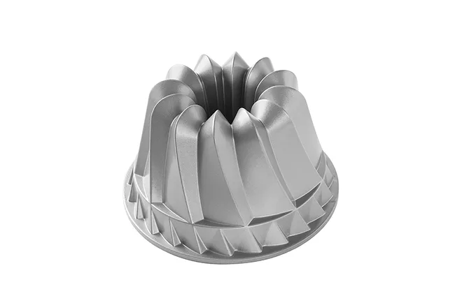 A silver Bundt cake pan with a geometric, fluted design.