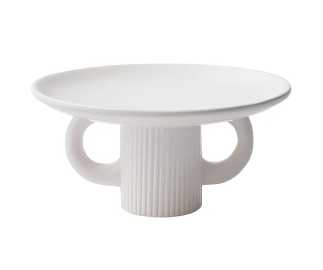 White ceramic cake stand with a ribbed pedestal and two handles.