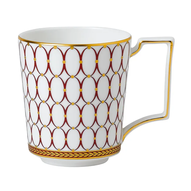Elegant white ceramic mug with red and gold geometric pattern and square handle.