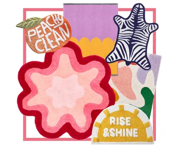 Colorful rugs in various shapes and patterns, including a zebra print, floral design, and text reading "Peachy Clean" and "Rise & Shine."