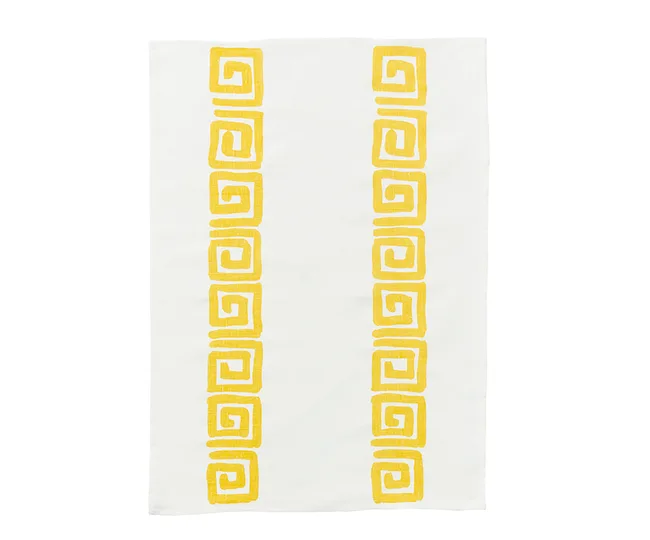 White cloth with rows of yellow geometric spiral patterns.