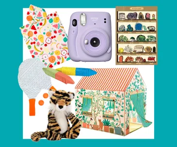 Colorful toys and items for kids, including a toy camera, play tent, plush tiger, paddle, and colorful crayons.