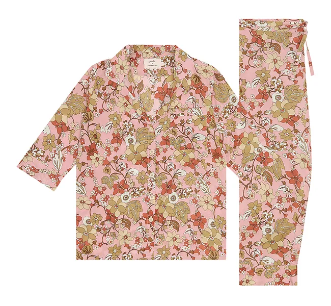 Pink floral print pajama set with button-up top and matching pants, featuring a pattern of red, yellow, and green flowers.