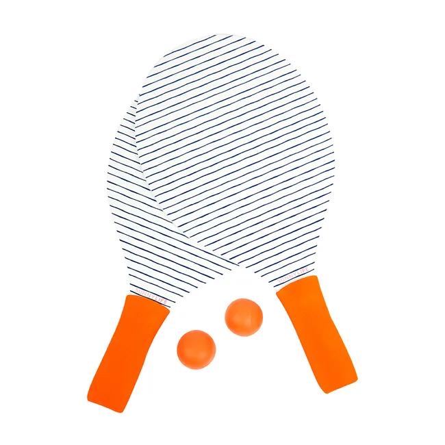 Two striped beach paddles with orange handles and two matching orange balls on a white background.