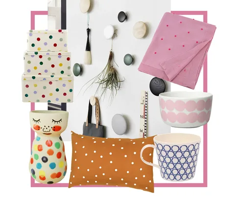 Polka dot themed decor items including boxes, wall hooks, textiles, and ceramics with colorful patterns and designs.