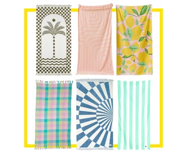 Colorful beach towels with varied patterns, including spirals, stripes, lemons, and checks, arranged in a grid.