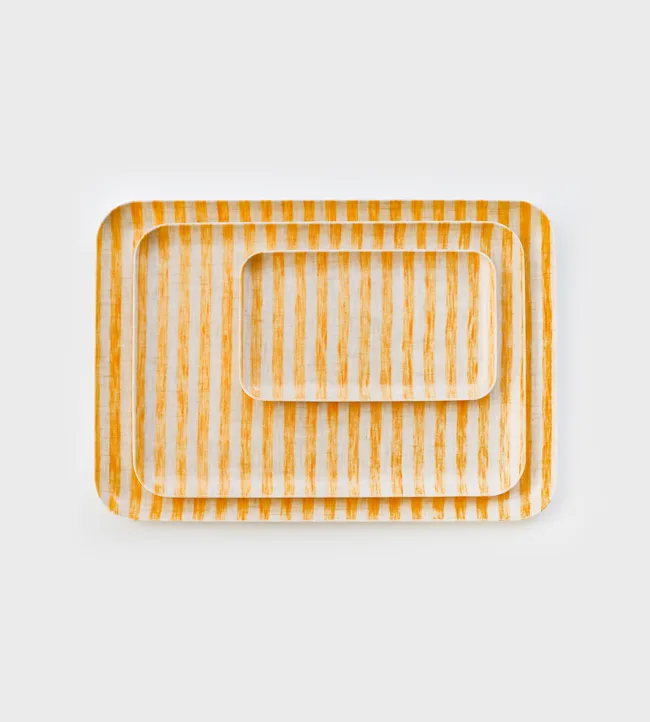 Stacked rectangular trays with orange vertical stripes on a white background.