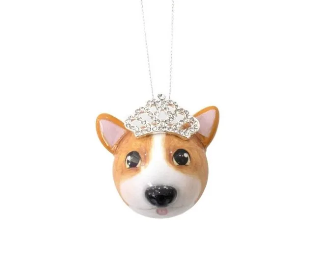 Corgi face ornament with a silver tiara hanging on a string.