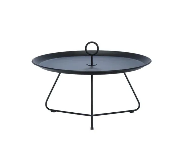 Circular black metal tray table with three thin legs and central handle on top.