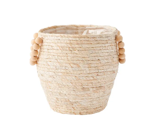 Woven beige basket with round wooden handles on sides.